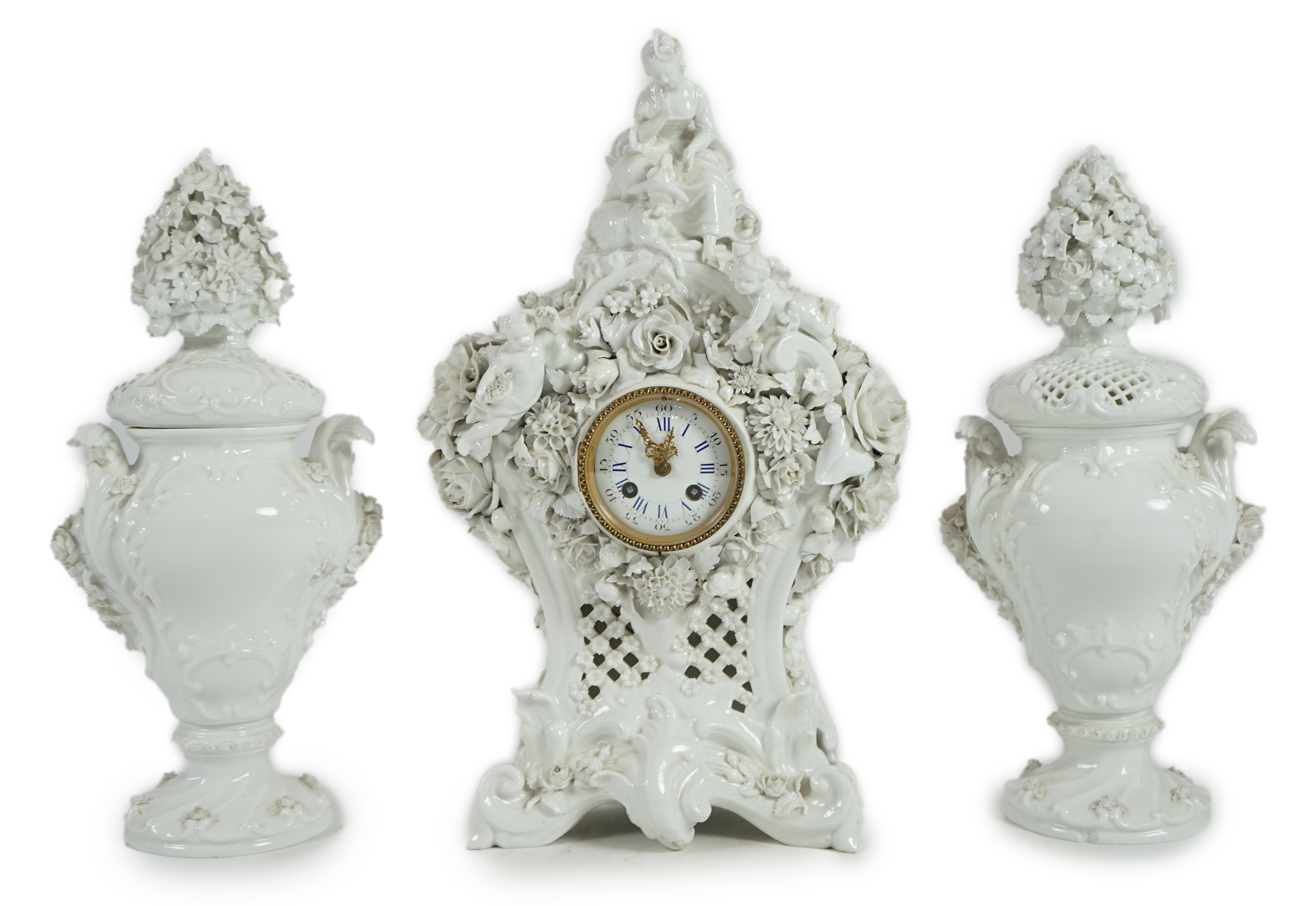 Vion & Baury. A 19th century Meissen style white glazed porcelain three piece clock set